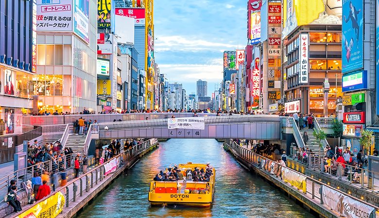 Tourists at Dotonbori shopping street in Osaka, Japan