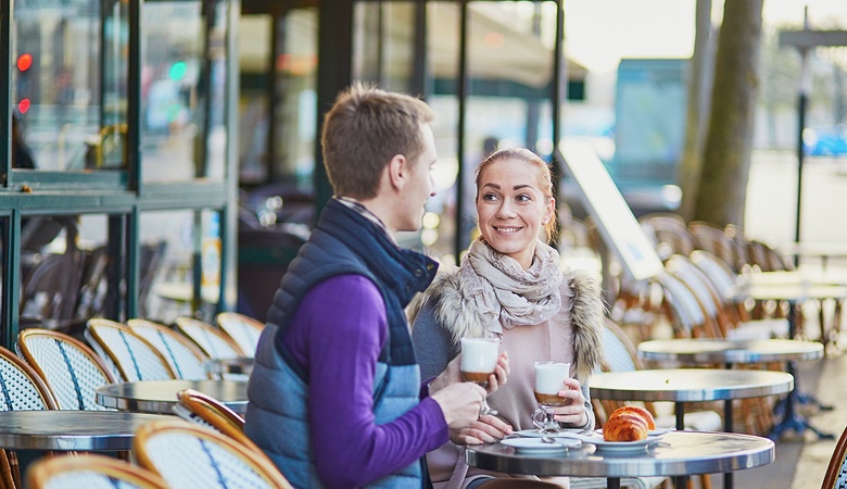 Young couple in cafe in Paris, France