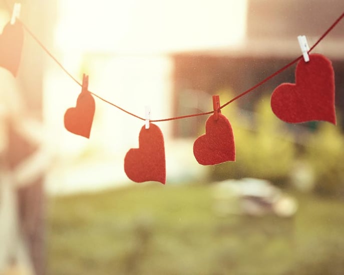 felt hearts hanging on a string outside