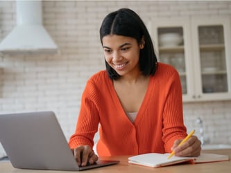 language service provider on computer taking translation notes