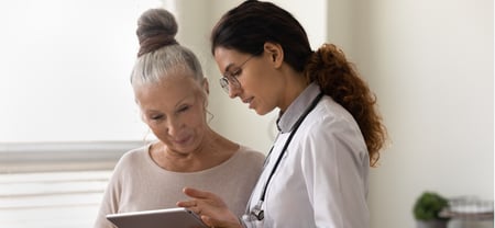 doctor reviewing translated document with patient