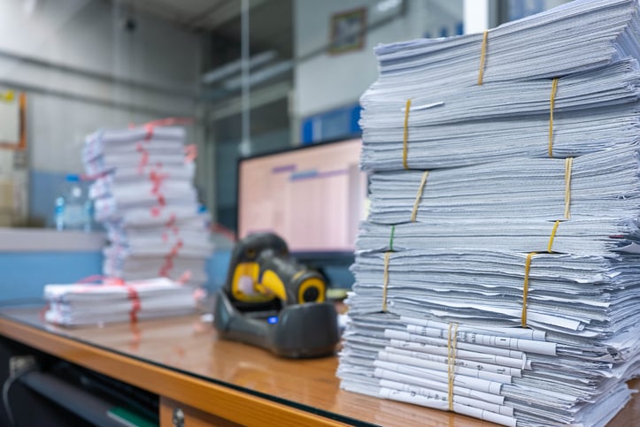 stacks of engineering documents on desk ready to be translated