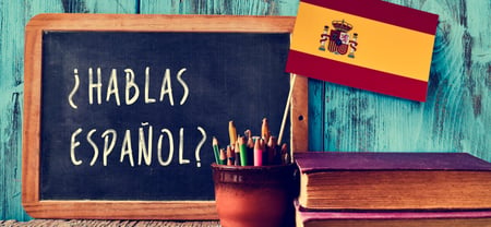 Hablas Espanol written on a small chalkboard