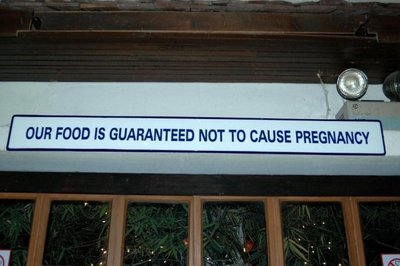 Sign says "Our food is guaranteed not to cause pregnancy."