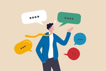 Man with tie juggling colorful speech bubbles, communication concept