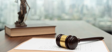 legal documents under a gavel