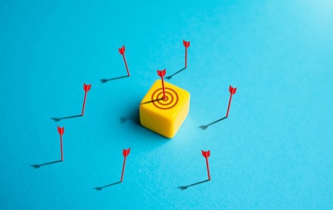 arrows surrounding a bullseye indicating inconsistent brand messaging