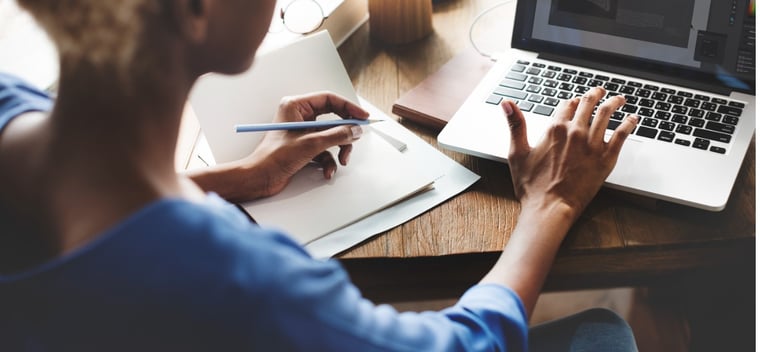 woman creating an RFP for an LSP at her desk