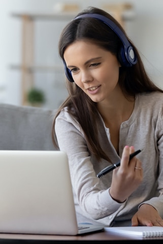 Picture of a woman working while talking via laptop video chat