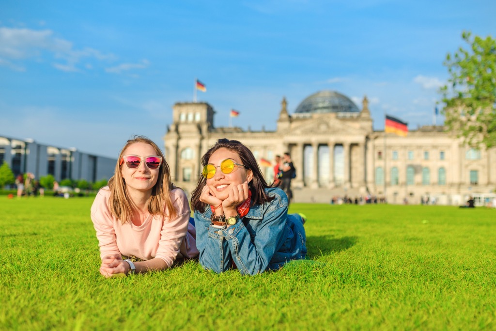 smiling women in front of the bundestag in berlin